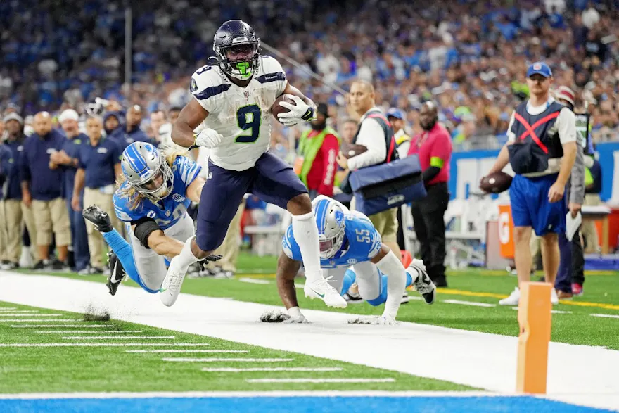 Kenneth Walker of the Seattle Seahawks runs the ball as we share our favorite Panthers vs. Seahawks prediction.