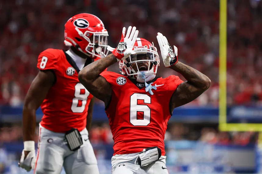 Georgia Bulldogs wide receiver Dominic Lovett reacts after a catch with wide receiver Colbie Young against the Clemson Tigers as we look at our Notre Dame vs. Georgia parlay picks.