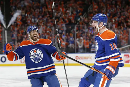 Zach Hyman celebrates a goal with Evan Bouchard during the second period against the Vancouver Canucks as Gary Pearson offers his best prop picks for Game 1 of the Western Conference final between the Edmonton Oilers and Dallas Stars. 