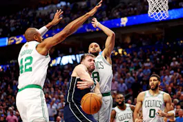 Dallas Mavericks guard Luka Doncic passes the ball against Boston Celtics center Al Horford and guard Derrick White during the fourth quarter of Game 3 of the 2024 NBA Finals. We look at both Doncic and Horford in our Celtics vs. Mavericks Parlay.