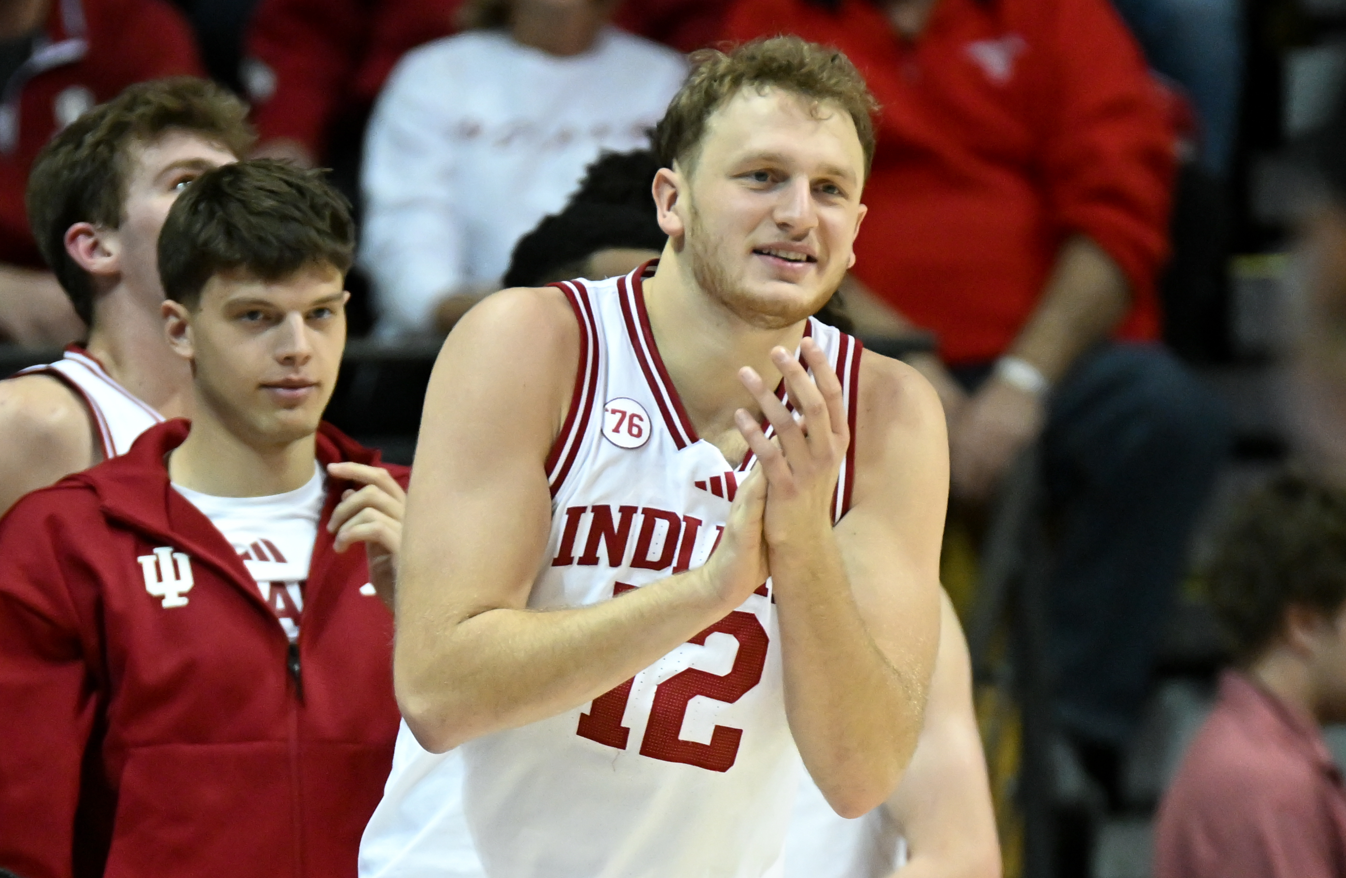 Indiana Hoosiers forward Tucker DeVries (12), seen here celebrating on the bench, is featured in our college basketball best bets today.