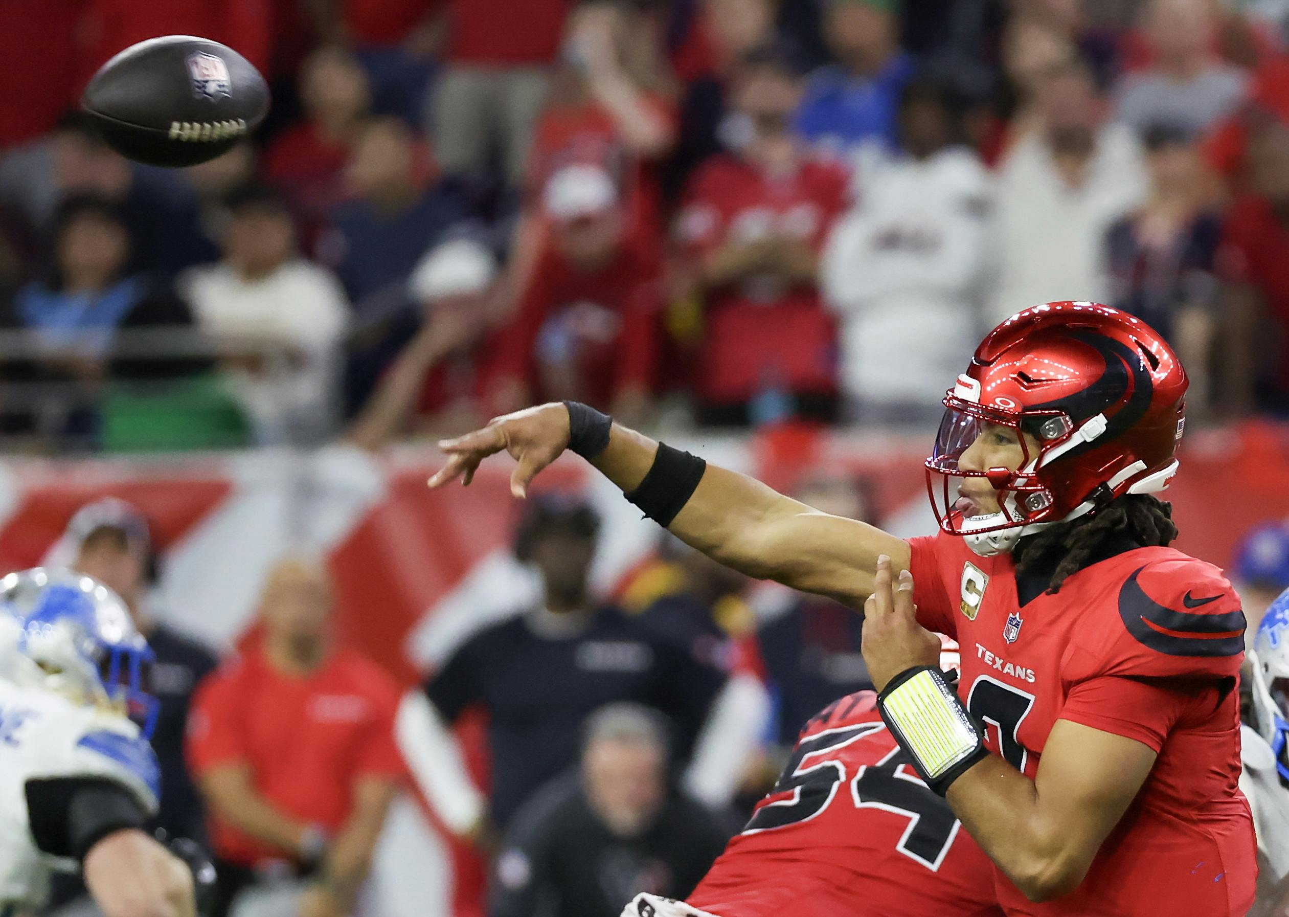 Houston Texans quarterback C.J. Stroud completes a pass against the Detroit Lions, and we offer our NFL Week 11 predictions.