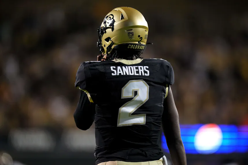 Colorado Buffaloes quarterback Shedeur Sanders (2) warms up as we compare the College Football 25 ratings to the betting odds for the College Football Playoff and Heisman Trophy.