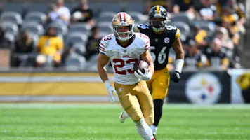San Francisco 49ers running back Christian McCaffrey runs as we look at the best NFL Week 5 odds and lines