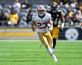 San Francisco 49ers running back Christian McCaffrey runs as we look at the best NFL Week 5 odds and lines
