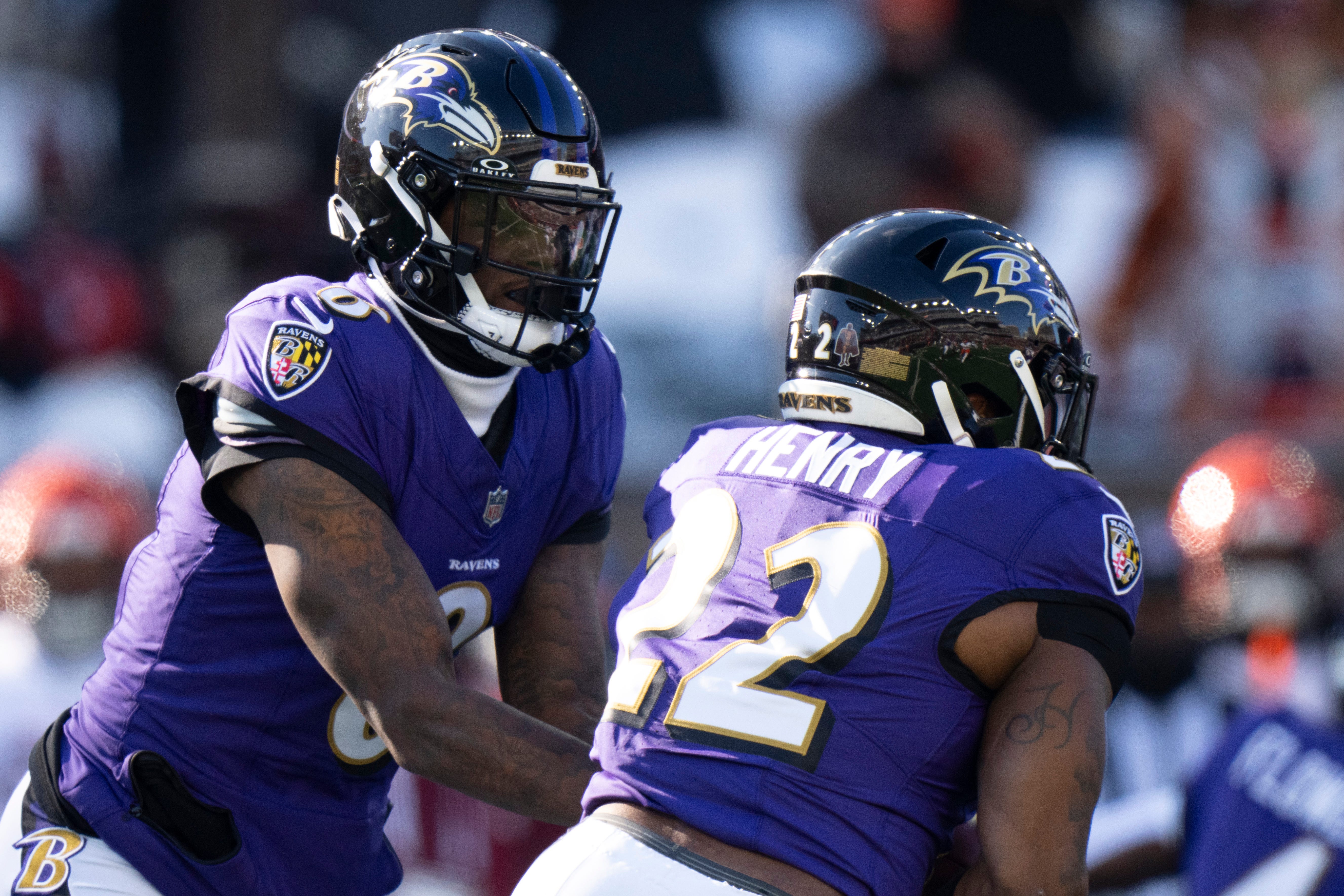 Baltimore Ravens quarterback Lamar Jackson (8) hands off to running back Derrick Henry (22) as we break down our Patriots vs. Ravens player props for Sunday Night Football.