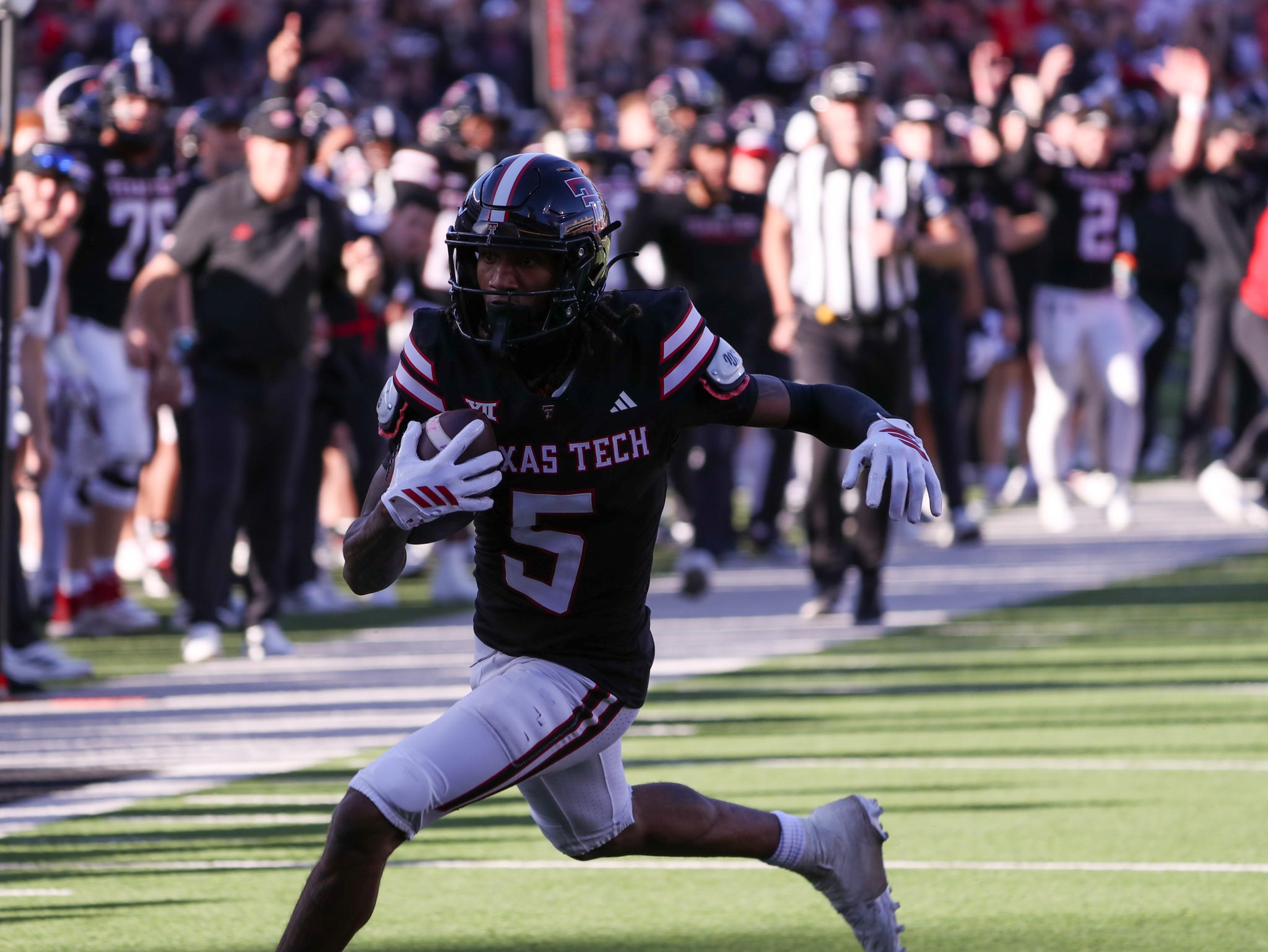Texas Tech's Caleb Douglas runs after a catch as we make our best Oregon vs. Texas Tech anytime touchdown scorer predictions