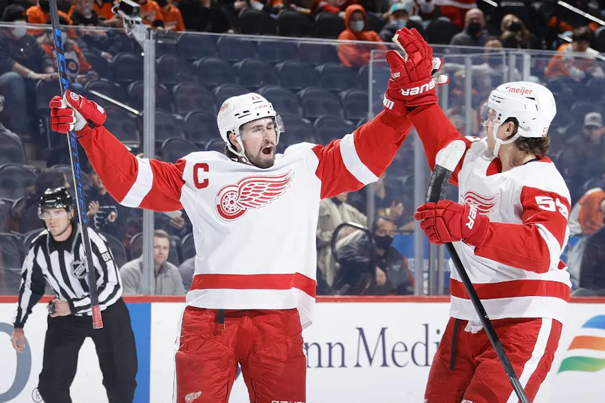 Dylan Larkin and Moritz Seider of the Detroit Red Wings celebrate a goal against the Philadelphia Flyers.
