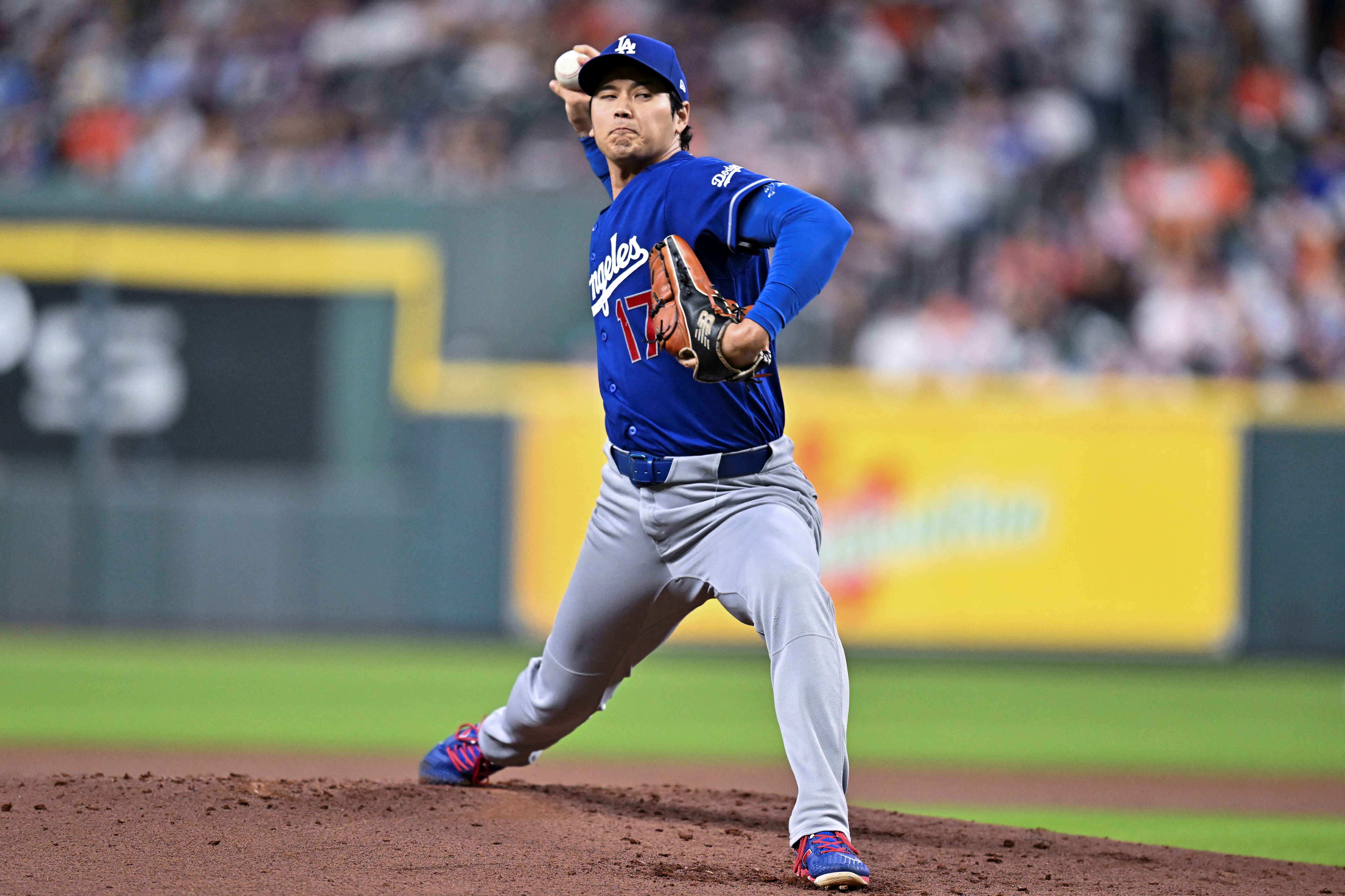Los Angeles Dodgers starting pitcher Shohei Ohtani delivers a pitch during, and he's featured as we look at the Giants vs. Dodgers win probability.