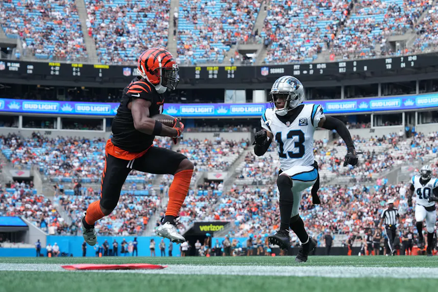 Cincinnati Bengals wide receiver Ja'Marr Chase makes a catch while Carolina Panthers cornerback Troy Hill defends as we offer our Ja'Marr Chase touchdown picks when the Bengals play the Ravens.