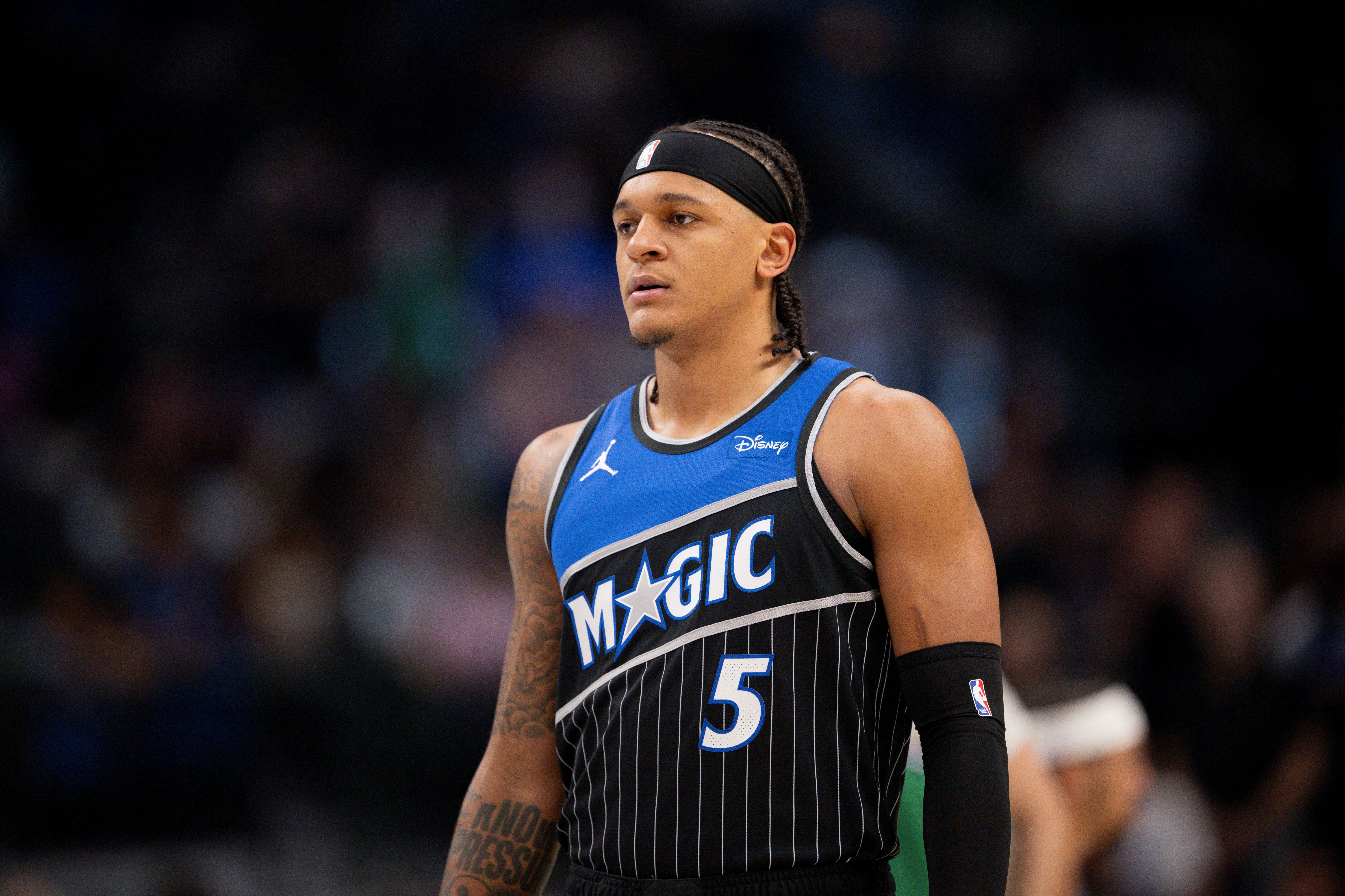 Orlando Magic forward Paolo Banchero (5) looks on as we break down our Magic vs. Pistons player props for Game 1 tonight.