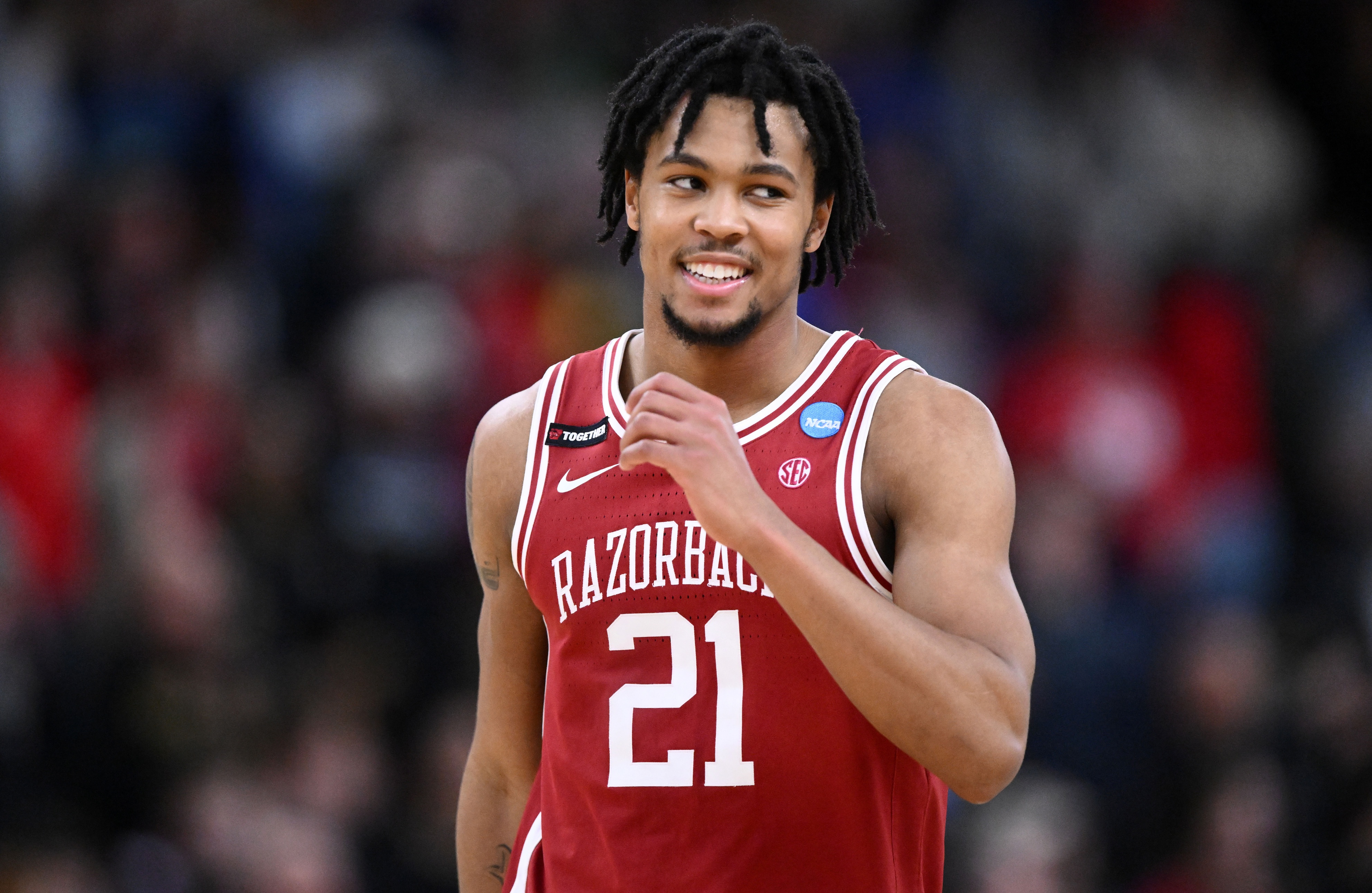 Arkansas Razorbacks guard D.J. Wagner (21) - who is featured in our Arkansas vs. Michigan State prediction, betting odds, and expert picks - celebrates.