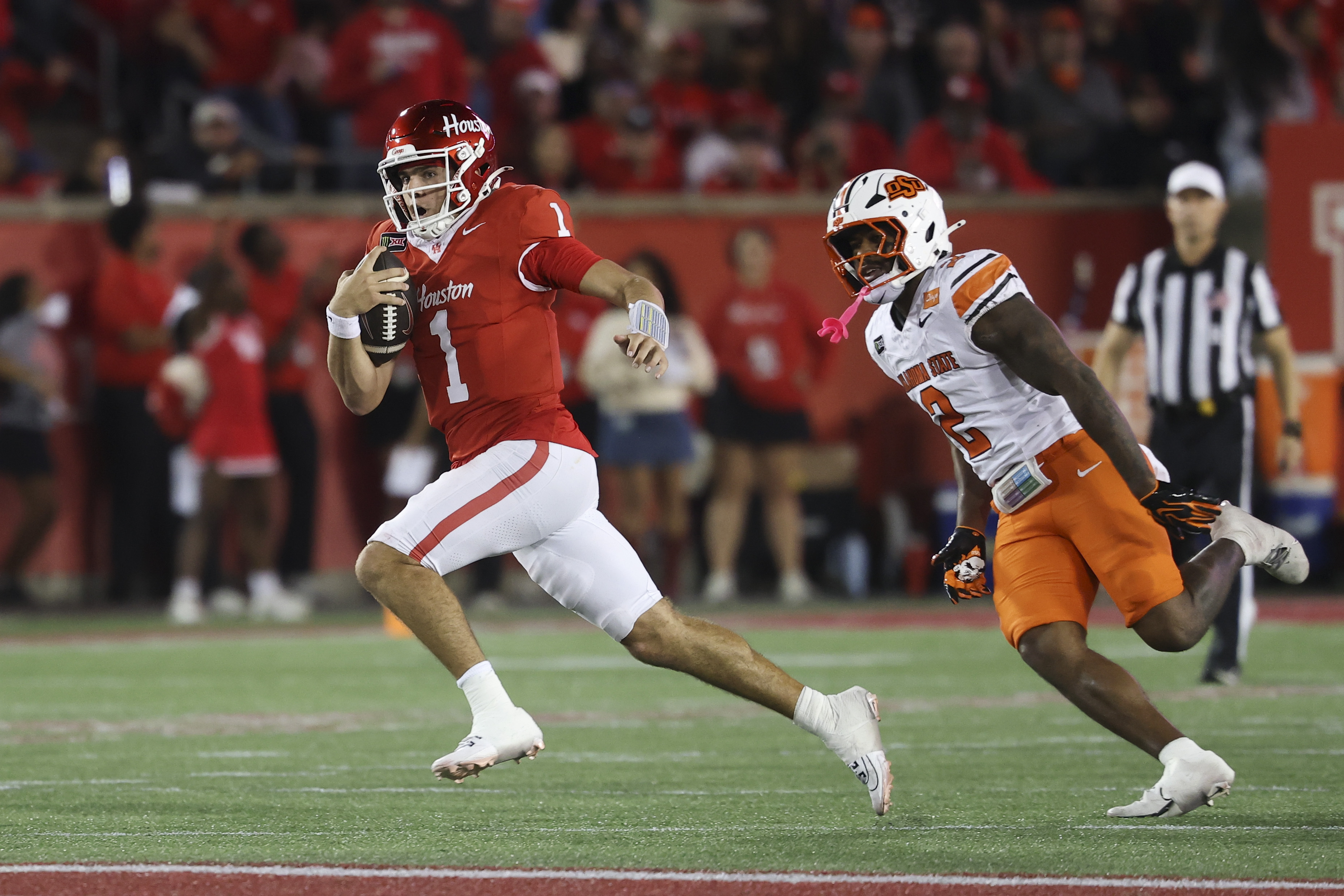 Houston Cougars quarterback Conner Weigman (1) runs with the ball as he is featured in our Houston vs. Utah prediction.