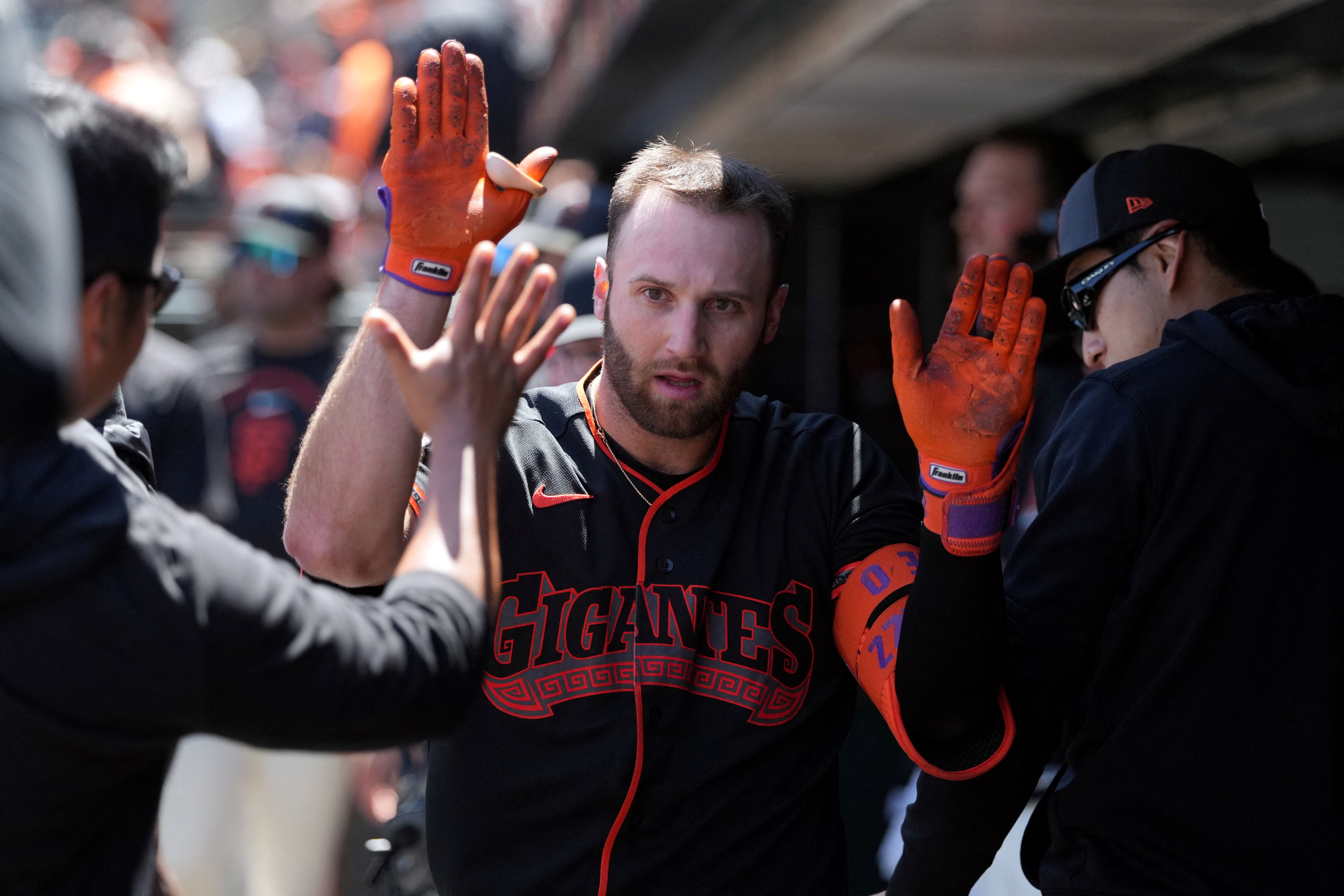 San Francisco Giants left fielder Casey Schmitt celebrates with teammates as we make our best White Sox vs. Giants prediction