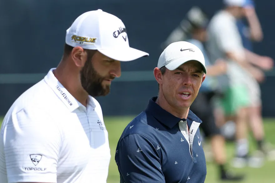 Jon Rahm of Spain and Rory McIlroy of Northern Ireland walk the second hole during a practice round prior to the 2022 U.S. Open at The Country Club on June 13, 2022 in Brookline, Massachusetts. Photo by Warren Little Getty Images via AFP.