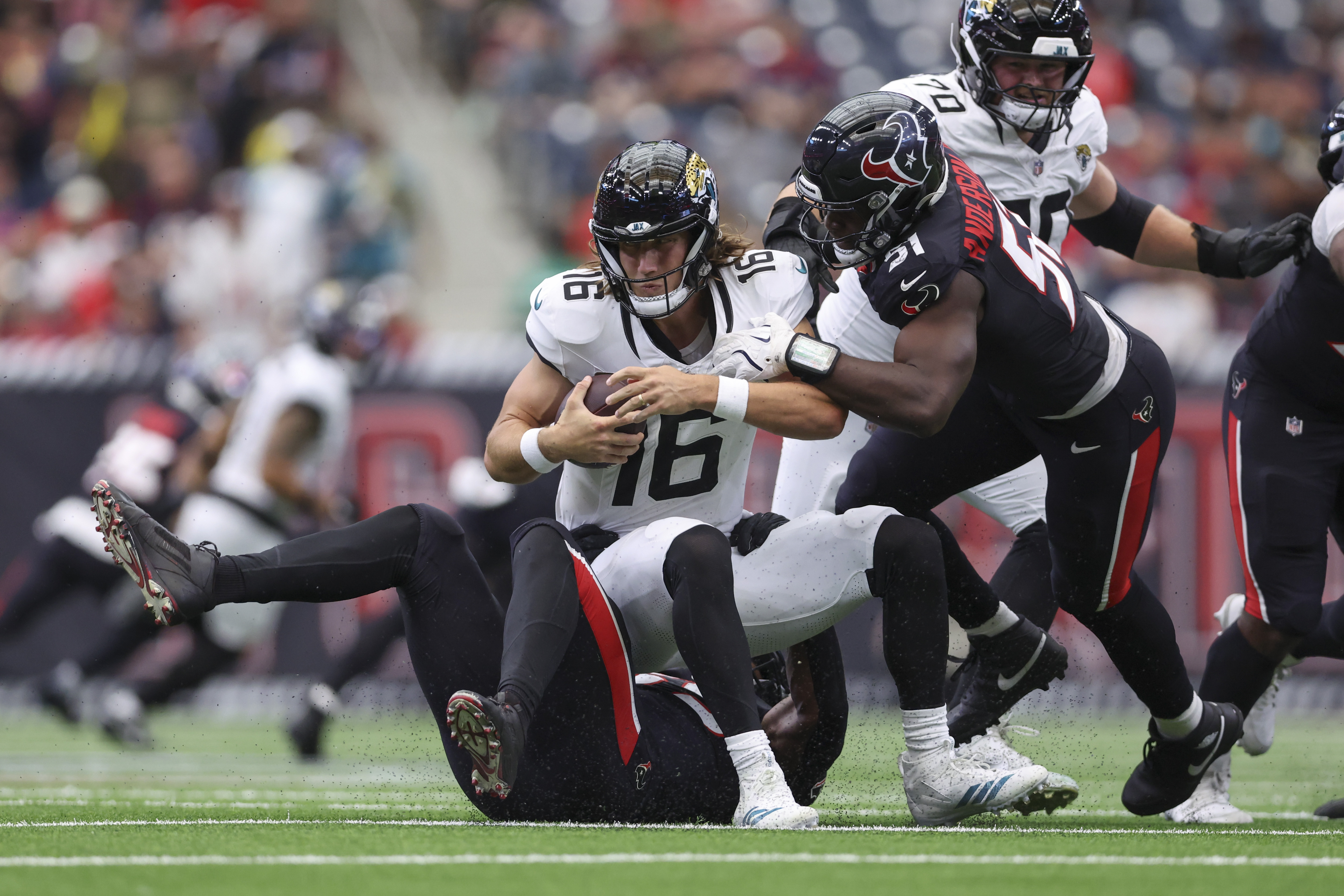 Houston Texans defensive end Will Anderson Jr. (51) sacks Jacksonville Jaguars quarterback Trevor Lawrence (16) as we provide our NFL moneyline picks for Week 6.