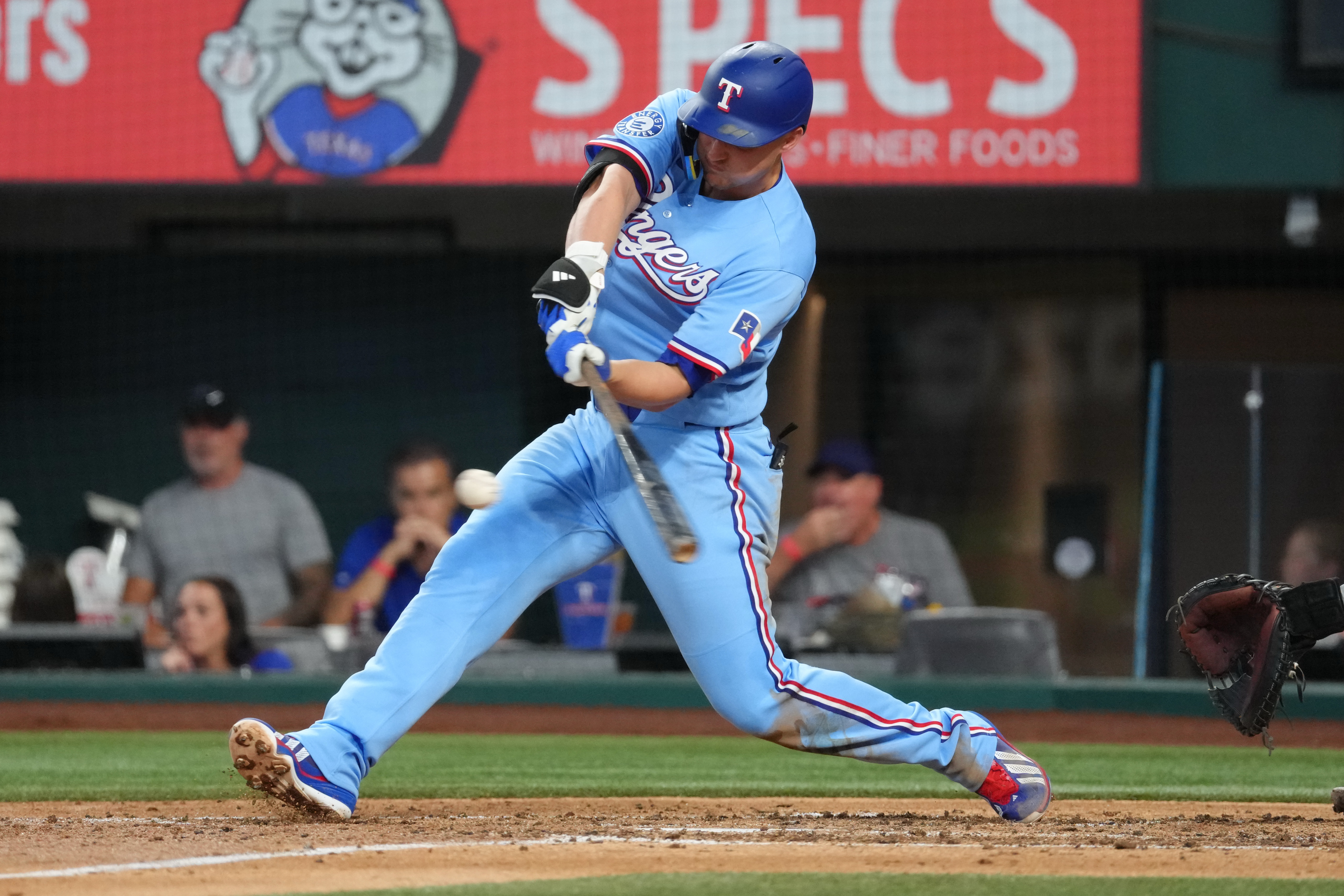 Texas Rangers shortstop Corey Seager (5) singles against the Los Angeles Angels during the fifth inning at Globe Life Field. 