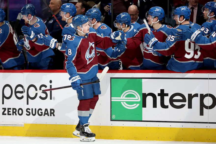 Cale Makar of the Colorado Avalanche is congratulated by his teammates after scoring a goal against the Nashville Predators in the first period during Game One of the First Round of the 2022 Stanley Cup Playoffs.