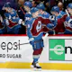Cale Makar of the Colorado Avalanche is congratulated by his teammates after scoring a goal against the Nashville Predators in the first period during Game One of the First Round of the 2022 Stanley Cup Playoffs.