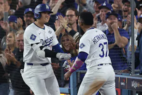 Los Angeles Dodgers designated hitter Shohei Ohtani (17) celebrates with right fielder Teoscar Hernandez (37) after hitting a home run as we dive into our Blue Jays vs. Dodgers same-game parlay for World Series Game 4 tonight.