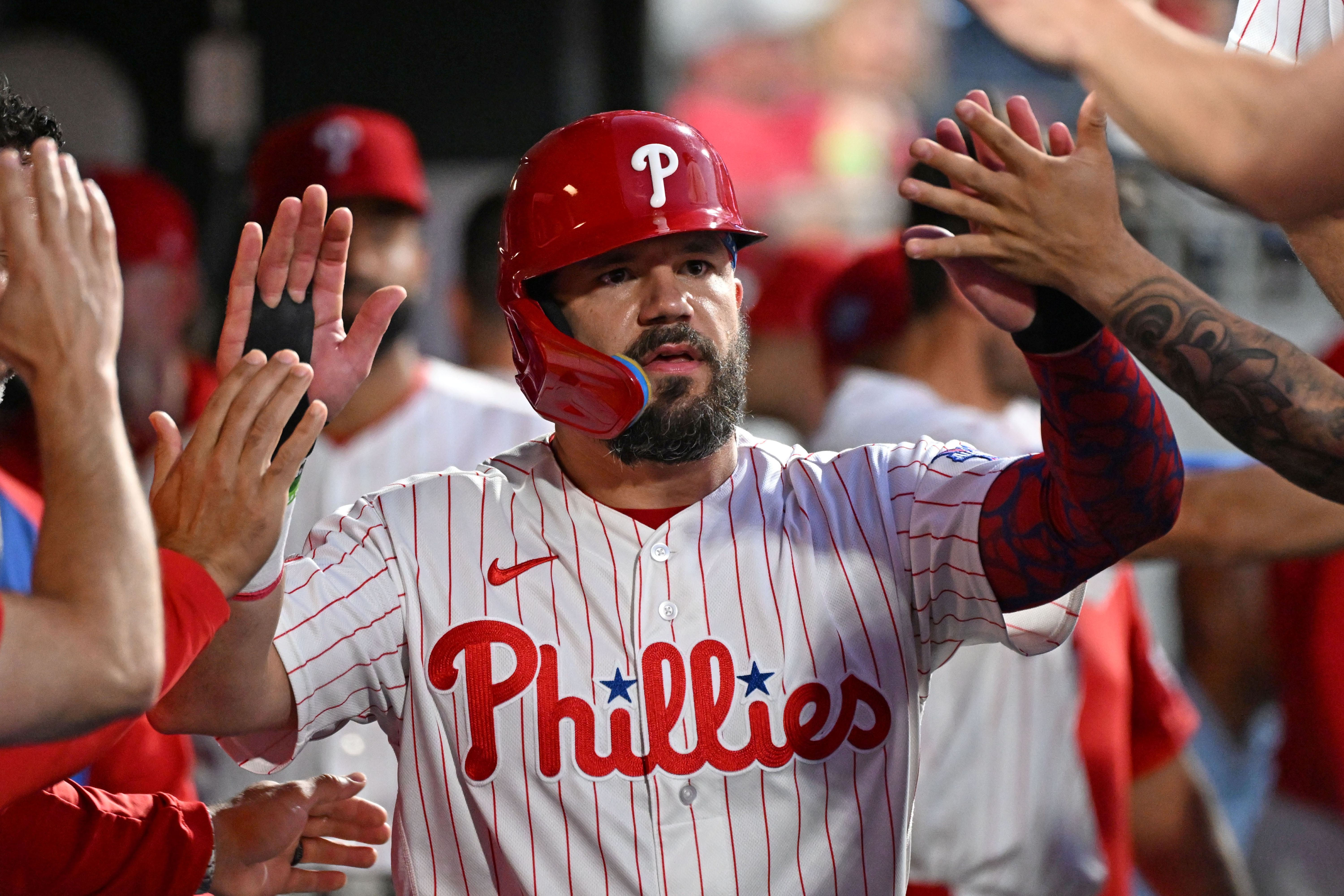 Philadelphia Phillies designated hitter Kyle Schwarber celebrates in the dugout, and he's featured in my Home Run Derby predictions.