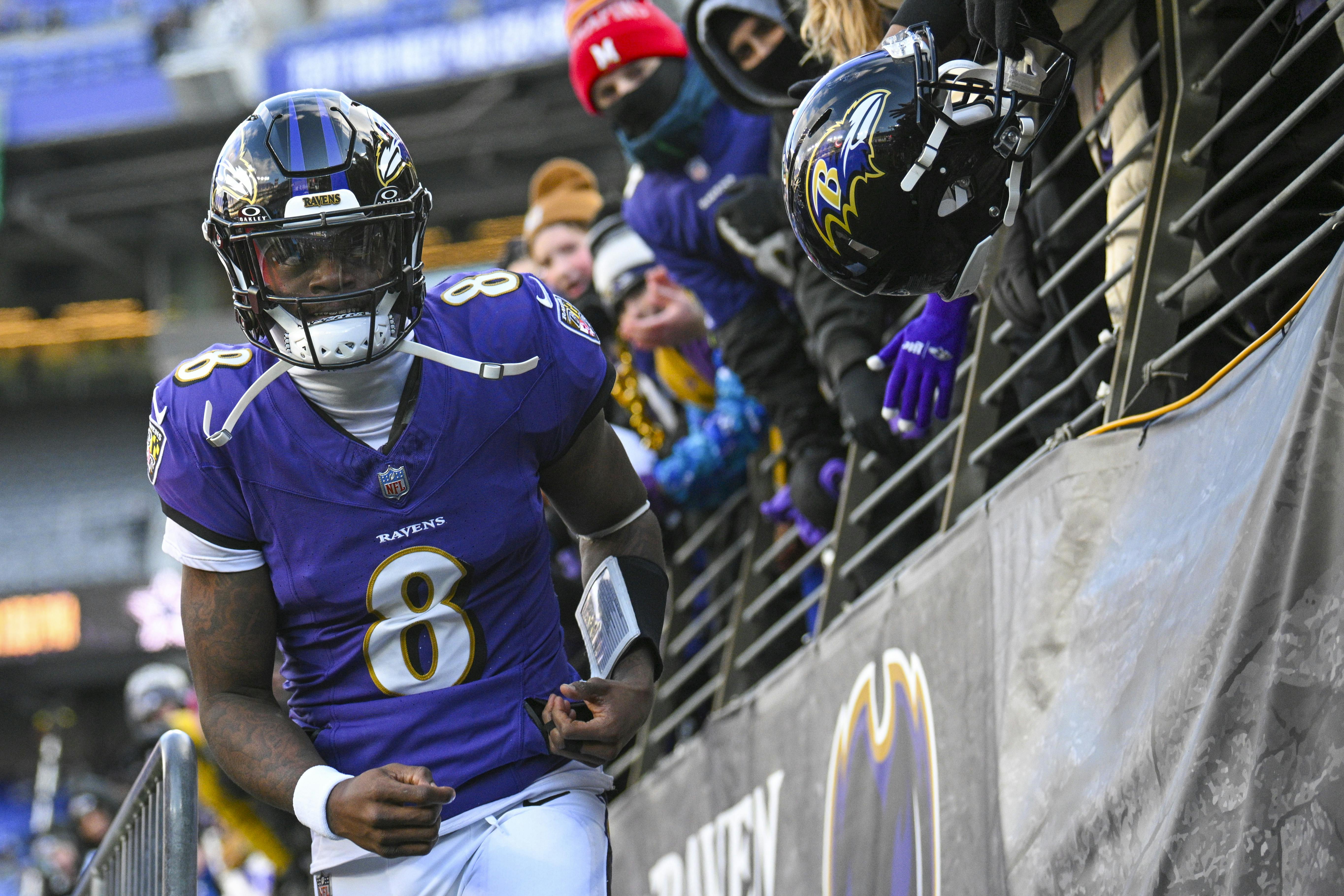 Baltimore Ravens quarterback Lamar Jackson (8) looks towards the crowd as we look at our Wild Card Weekend best bets.