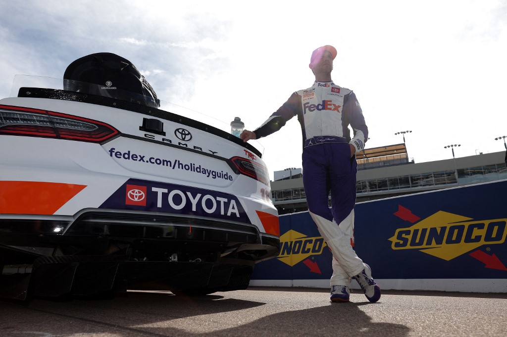 Denny Hamlin waits on the grid during qualifying for the NASCAR Cup Series Championship and is a driver to watch in the Daytona 500 odds.