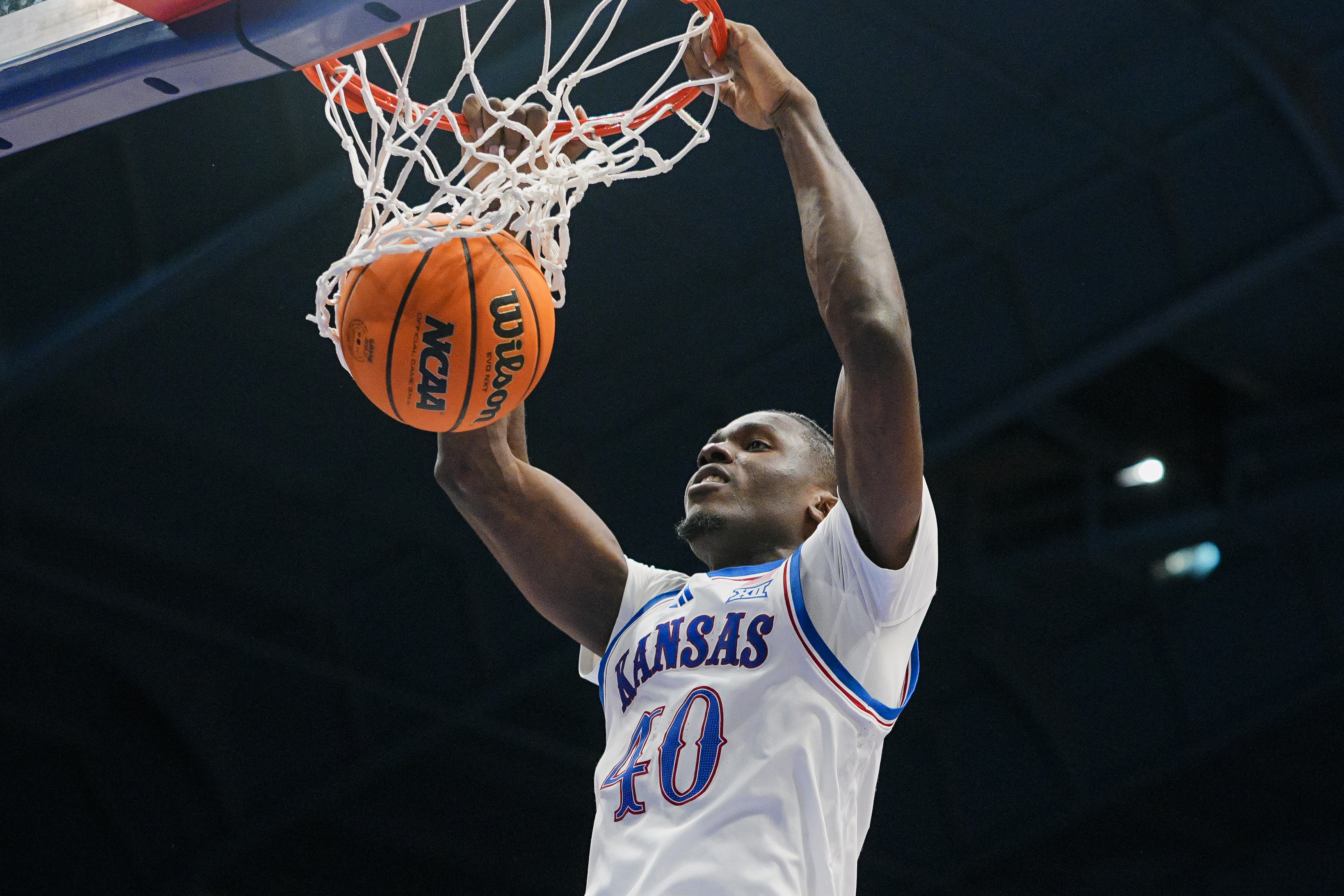 Kansas Jayhawks forward Flory Bidunga dunks the ball as we make our best Kansas vs. North Carolina prediction.