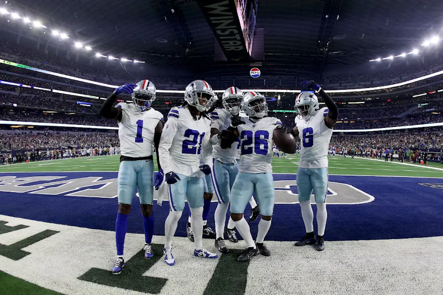DaRon Bland #26 of the Dallas Cowboys celebrates with teammates after an interception as we look at our Week 11 parlay picks.