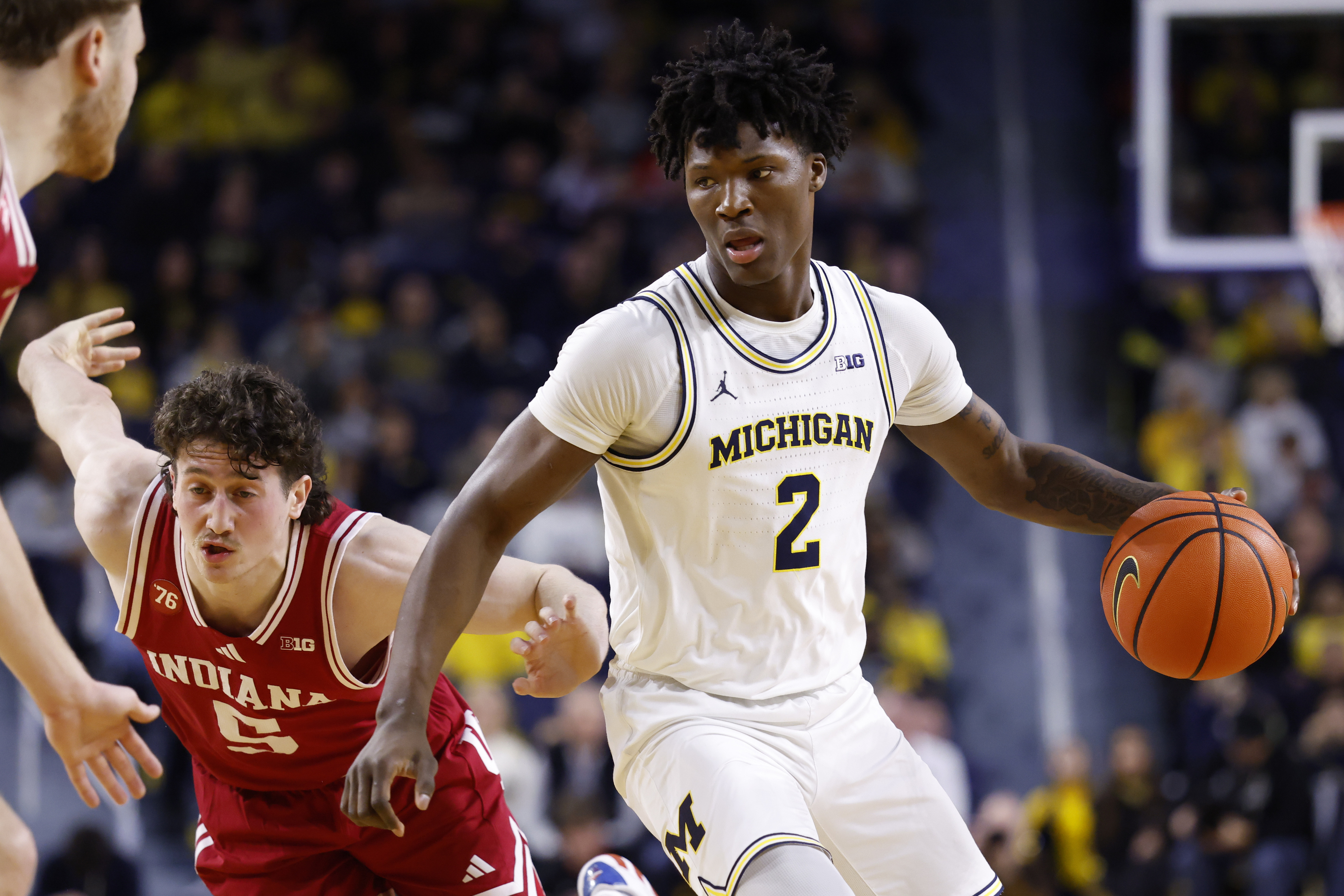 Michigan's L.J. Cason (2) is the focus of our Michigan vs. Illinois prediction. 