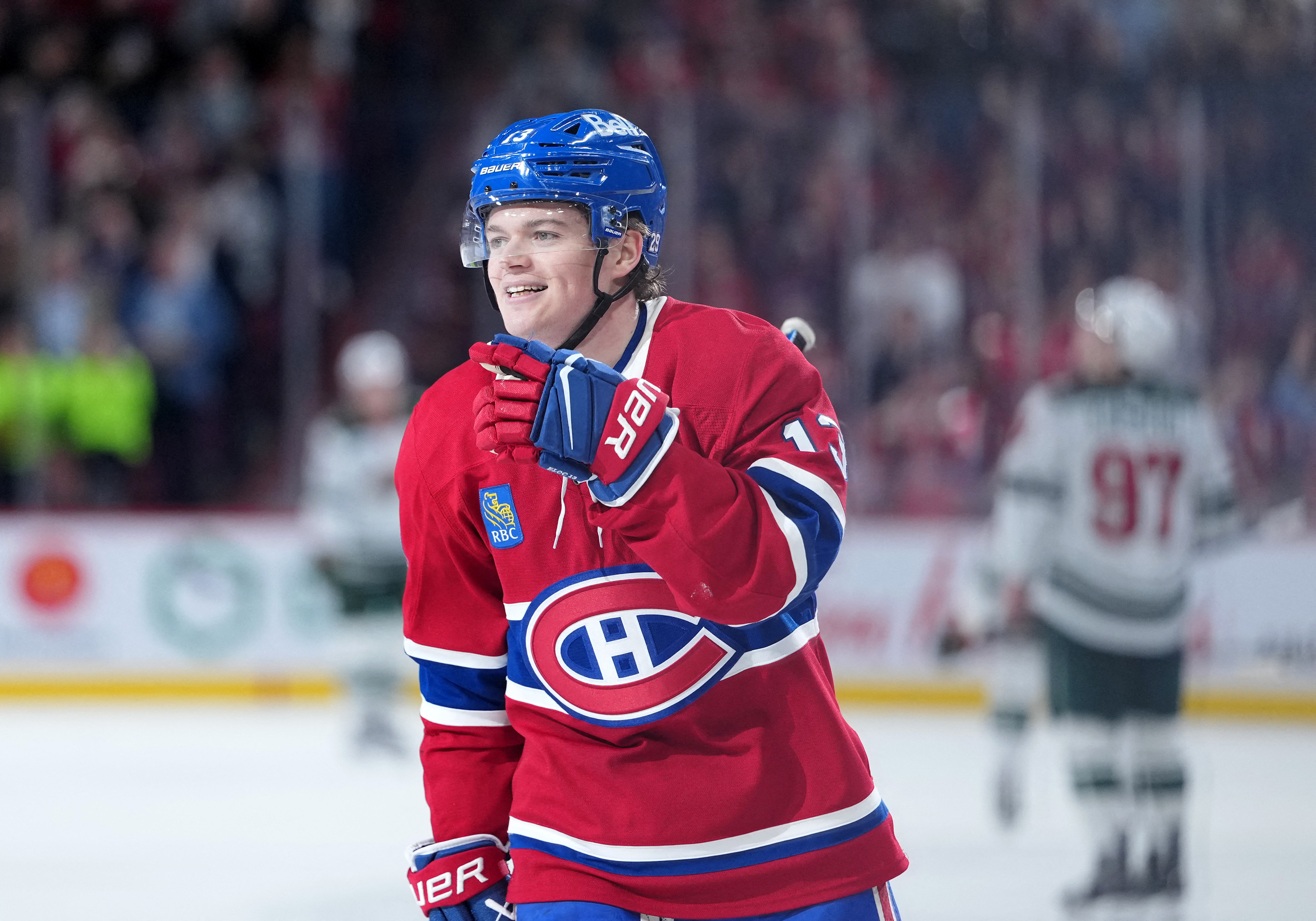 Montreal Canadiens forward Cole Caufield (13) celebrates as we offer our NHL anytime goal scorer predictions today.