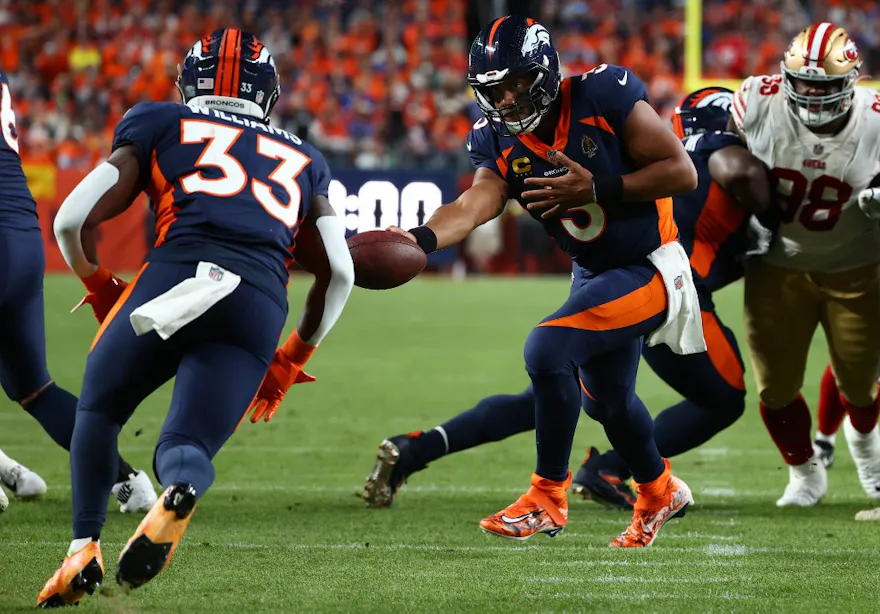 Russell Wilson #3 of the Denver Broncos hands off to Javonte Williams #33 during the first half against the San Francisco 49ers at Empower Field At Mile High on September 25, 2022.