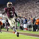 Trey Benson of the Florida State Seminoles scores a touchdown as we look at the latest ACC championship odds.