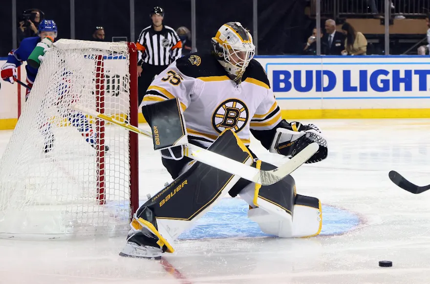 Boston Bruins goaltender Linus Ullmark is positioned to make a save against the New York Rangers.