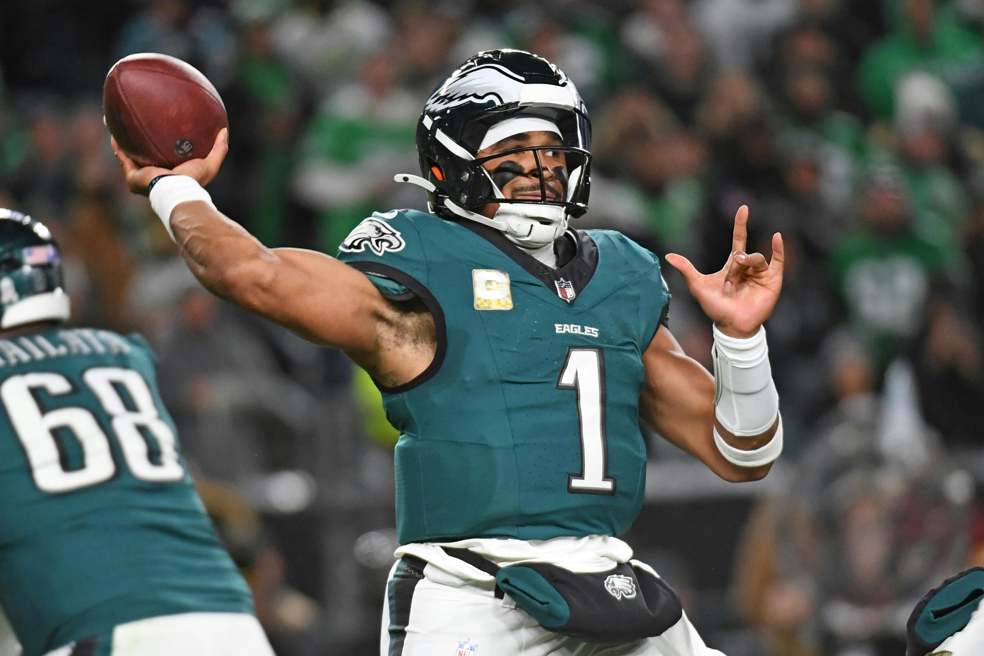 Philadelphia Eagles quarterback Jalen Hurts throws a pass as we break down the latest 2025 Super Bowl odds after NFL Week 12.