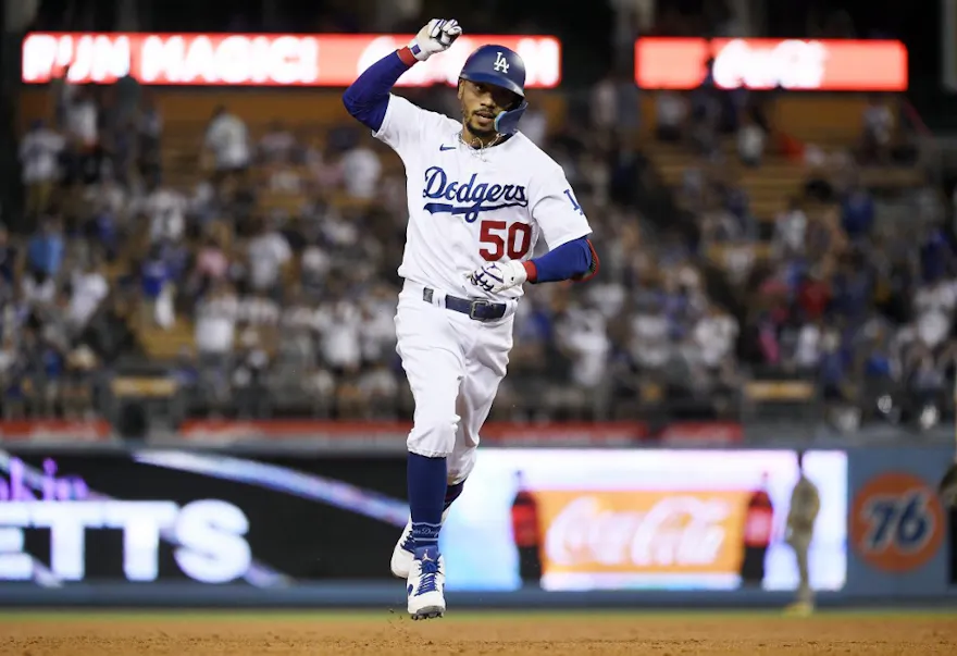 Mookie Betts of the Los Angeles Dodgers celebrates after hitting three-run home run during the fourth inning against the San Diego Padres at Dodger Stadium.