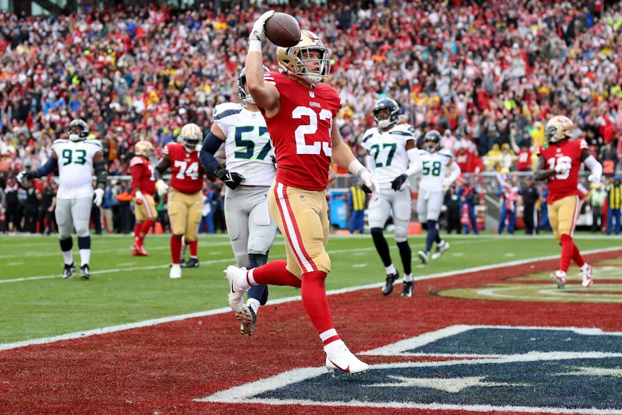 Christian McCaffrey of the San Francisco 49ers celebrates after scoring a 3-yard touchdown against the Seattle Seahawks in the NFC Wild Card playoff game at Levi's Stadium on Jan. 14, 2023 in Santa Clara, California.