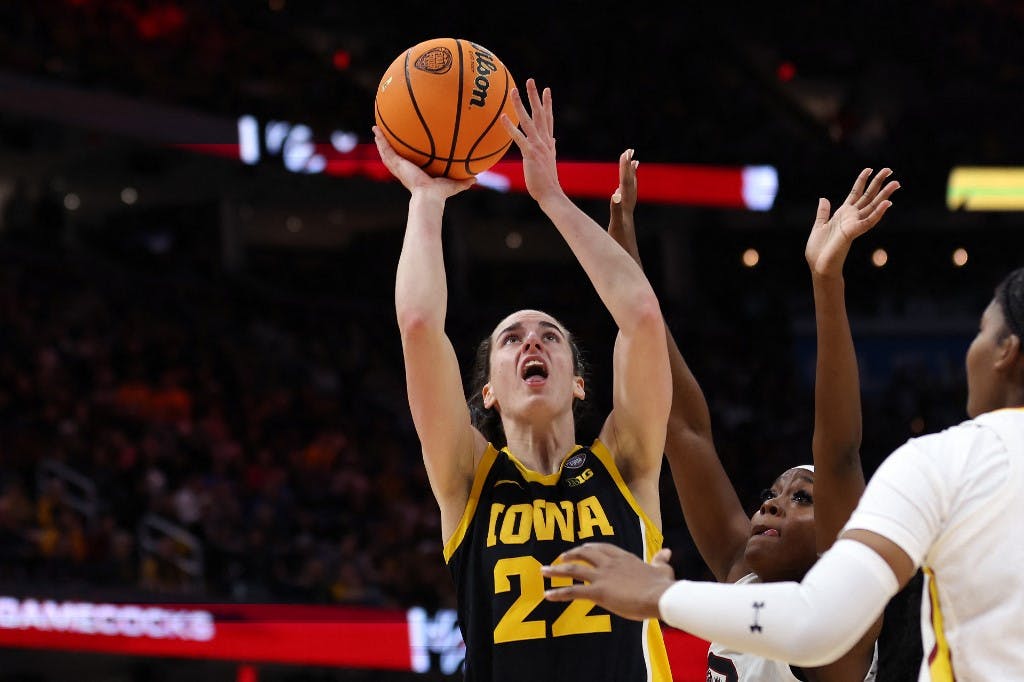 Caitlin Clark of the Iowa Hawkeyes shoots the ball over Raven Johnson of the South Carolina Gamecocks in the second half during the 2024 NCAA Women