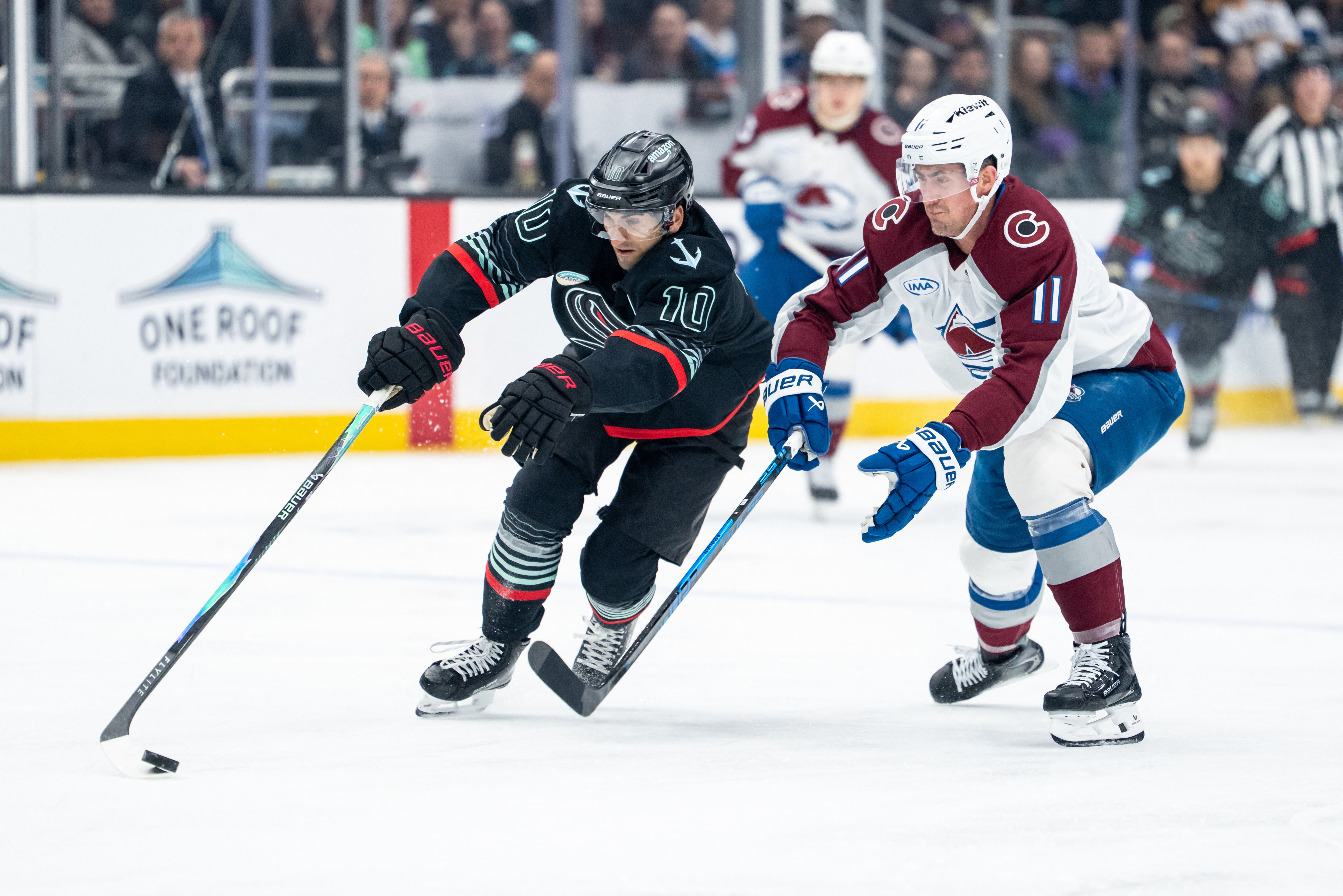 Seattle Kraken forward Matty Beniers (10) skates against Colorado Avalanche forward Brock Nelson (11) as we provide our Kraken vs. Avalanche prediction and picks.