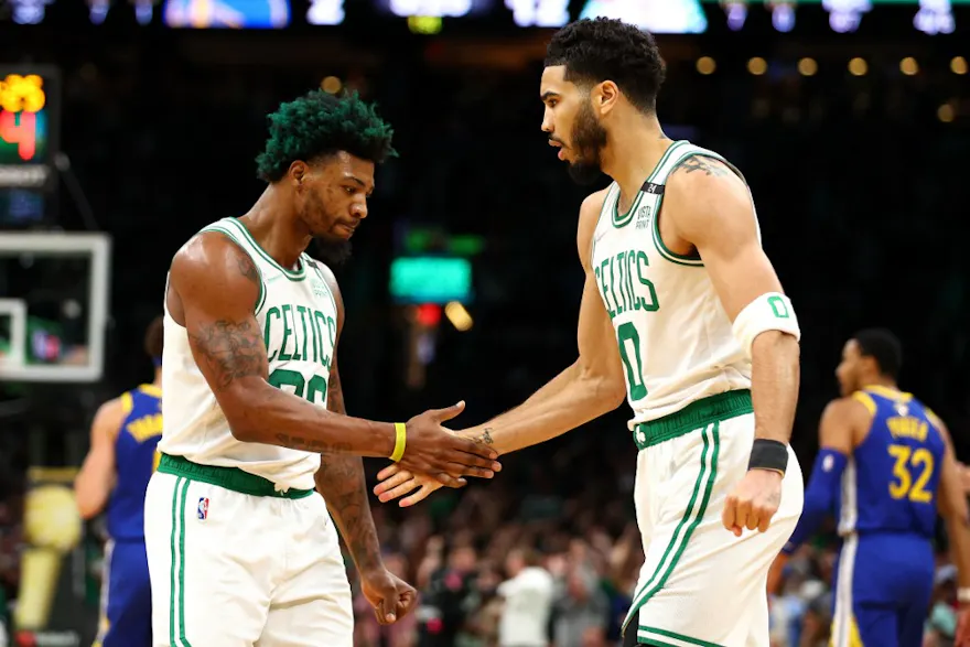 Marcus Smart and Jayson Tatum of the Boston Celtics celebrate a basket as we look at our top Heat vs. Celtics predictions
