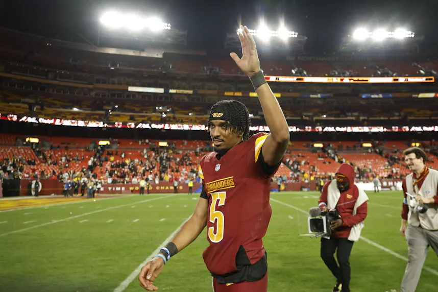 Washington Commanders quarterback Jayden Daniels celebrates while leaving the field after the game against the Atlanta Falcons, and he headlines our anytime touchdown scorer predictions for Wild Card Weekend.