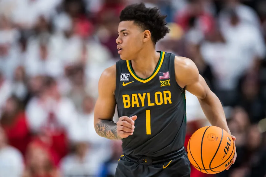 Guard Keyonte George of the Baylor Bears handles the ball during the first half against the Texas Tech Red Raiders.