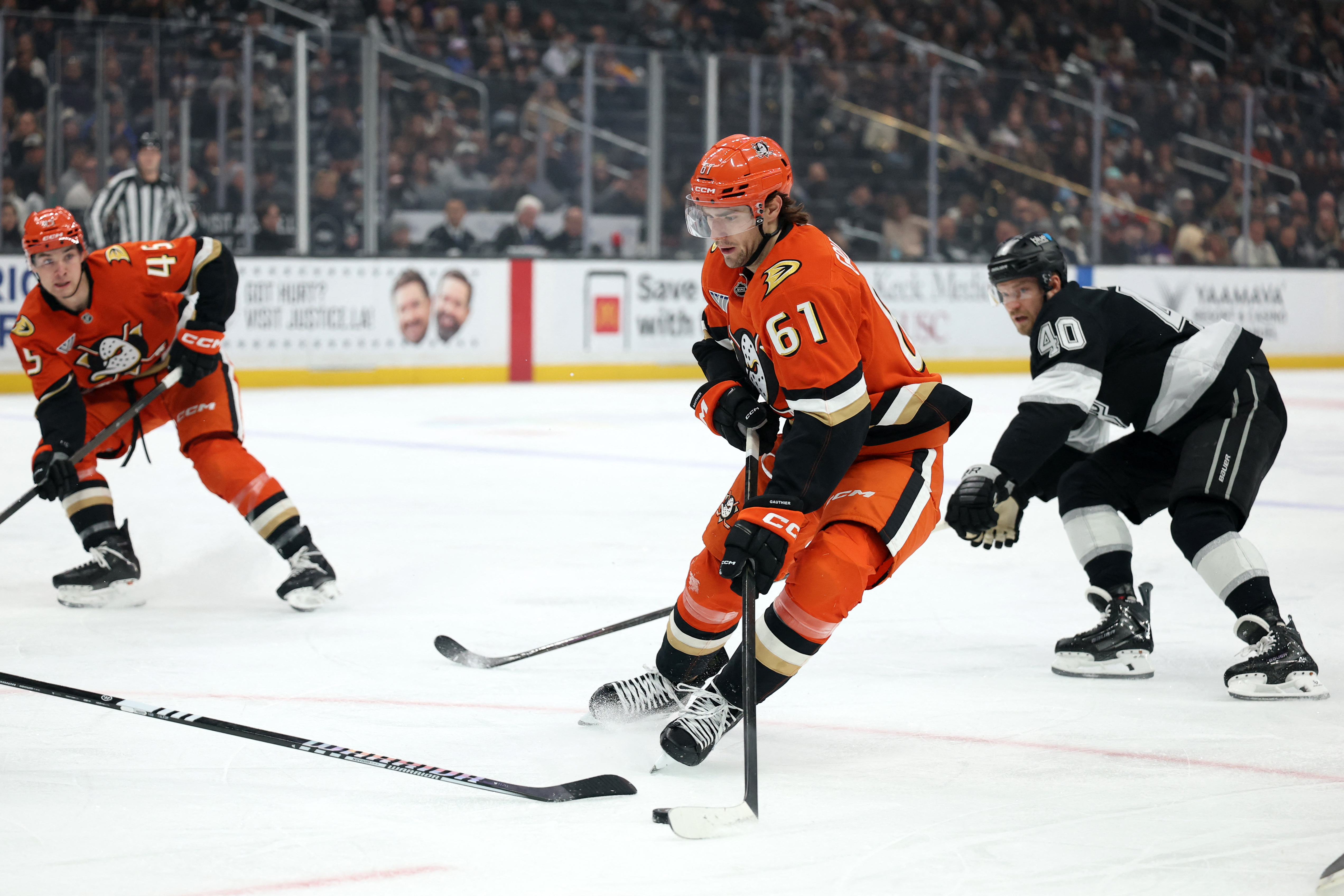 Cutter Gauthier skates with the puck ahead of Joel Armia as we provide our Golden Knights vs. Ducks prediction, picks and best bets today.