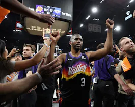 Chris Paul of the Phoenix Suns high fives fans after defeating the New Orleans Pelicans at Footprint Center in Phoenix, Arizona. Photo by Christian Petersen/Getty Images via AFP.