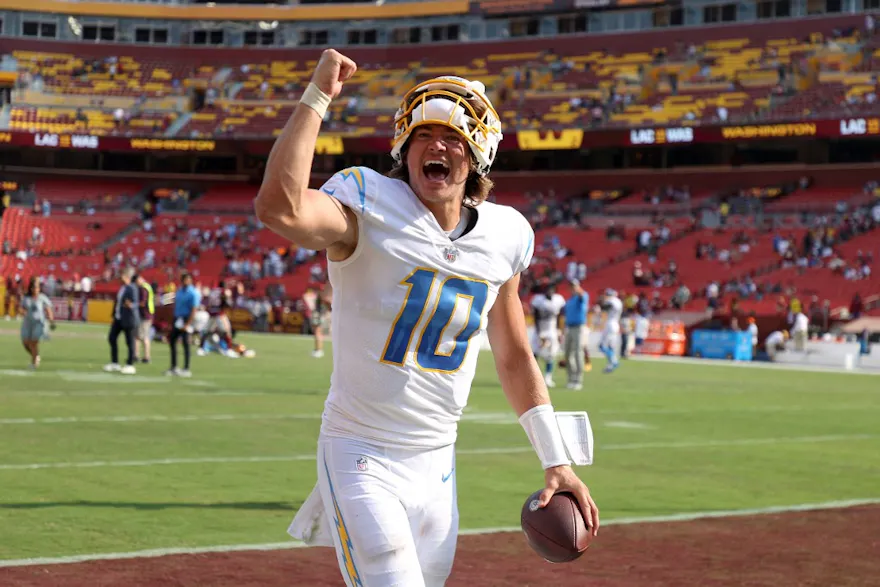 uarterback Justin Herbert of the Los Angeles Chargers celebrates while leaving the field following the Chargers' win over the Washington Football Team