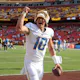 Quarterback Justin Herbert of the Los Angeles Chargers celebrates while leaving the field following his team's win over the Washington Commanders, and we offer our top player props for Patriots vs. Chargers based on the best NFL odds.