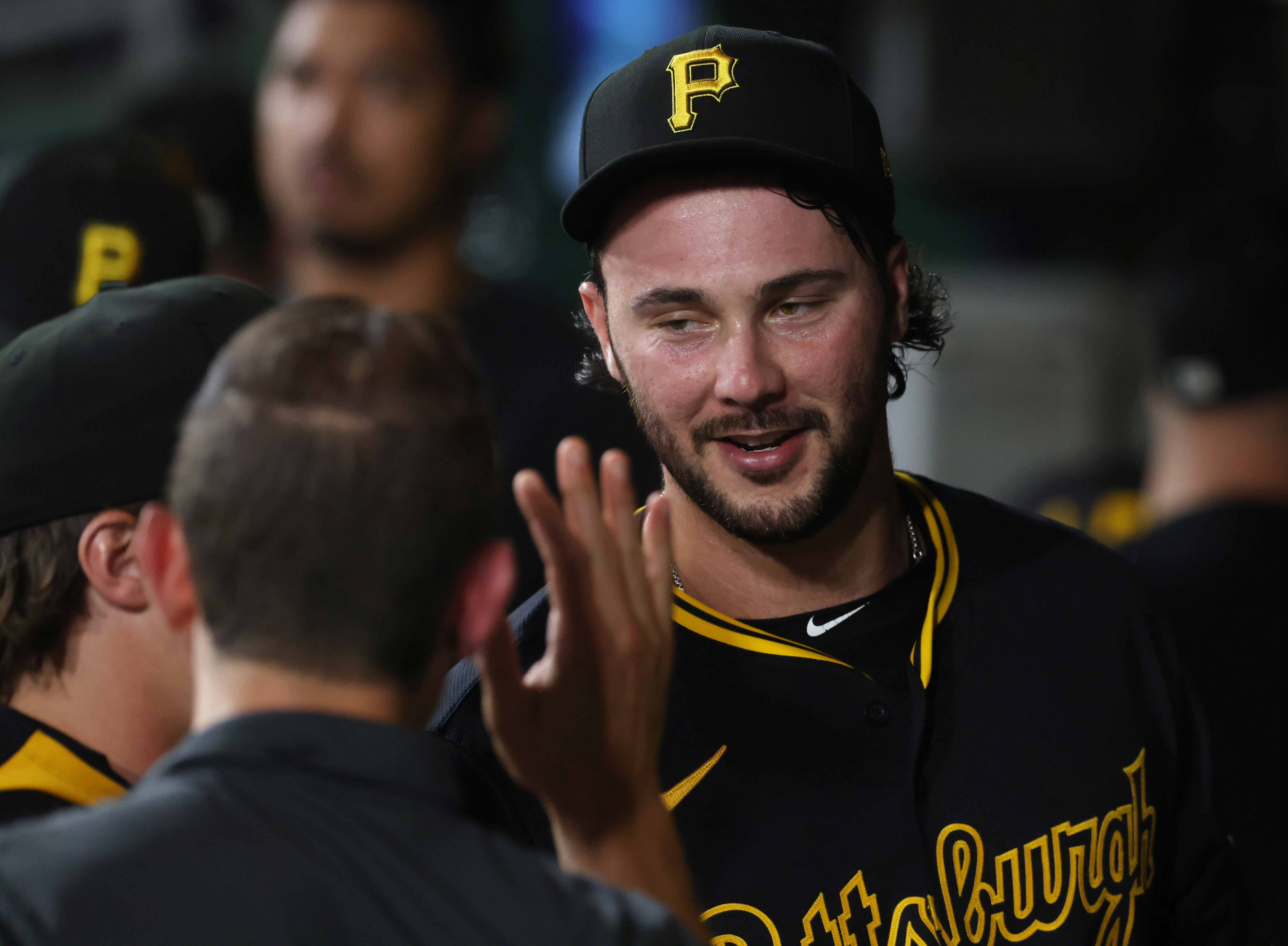 Pittsburgh Pirates starting pitcher Paul Skenes - who's featured in my MLB best bets for Opening Day - high-fives in the dugout. 