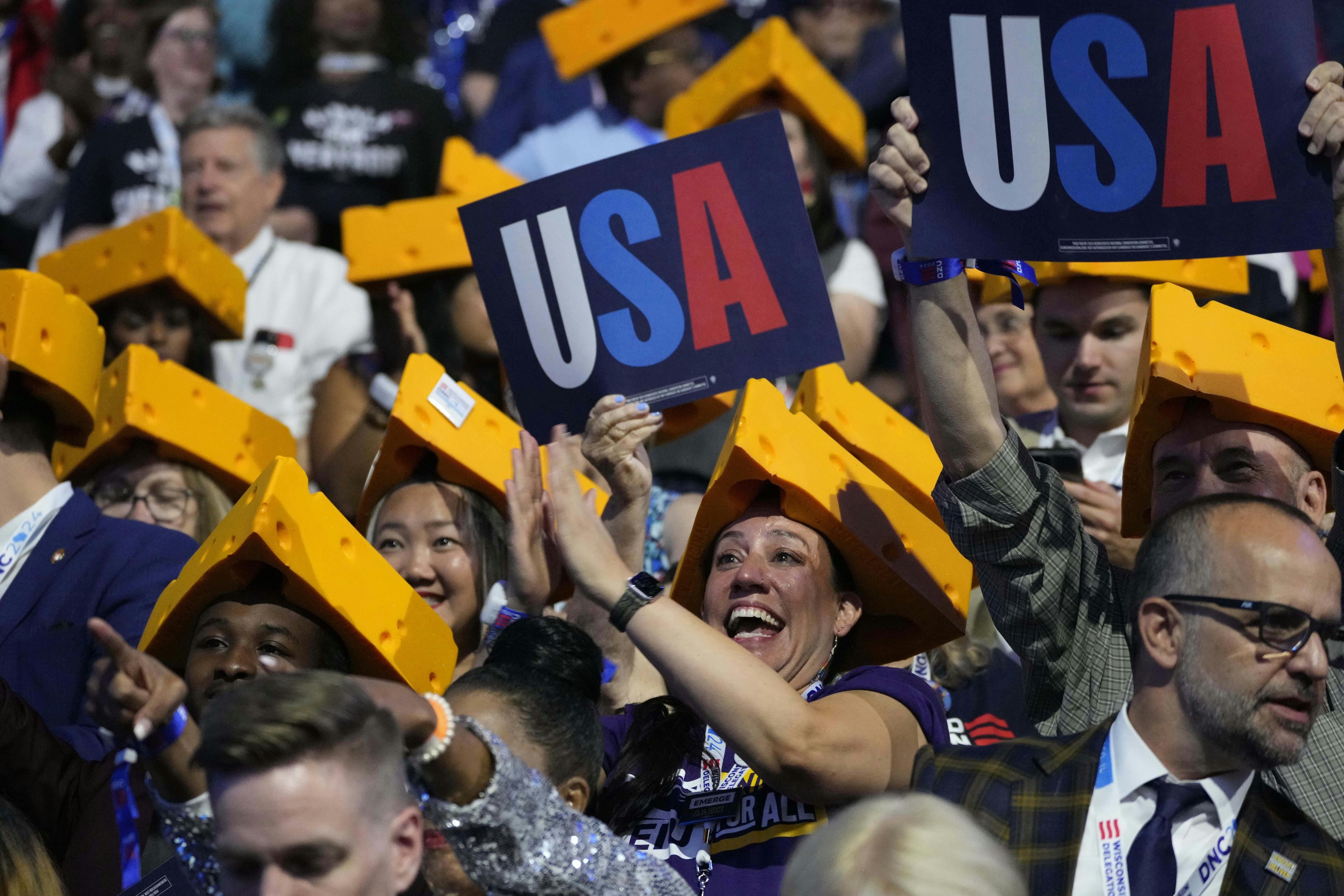 Wisconsin delegates cheer during the second day of the Democratic National Convention.<br>