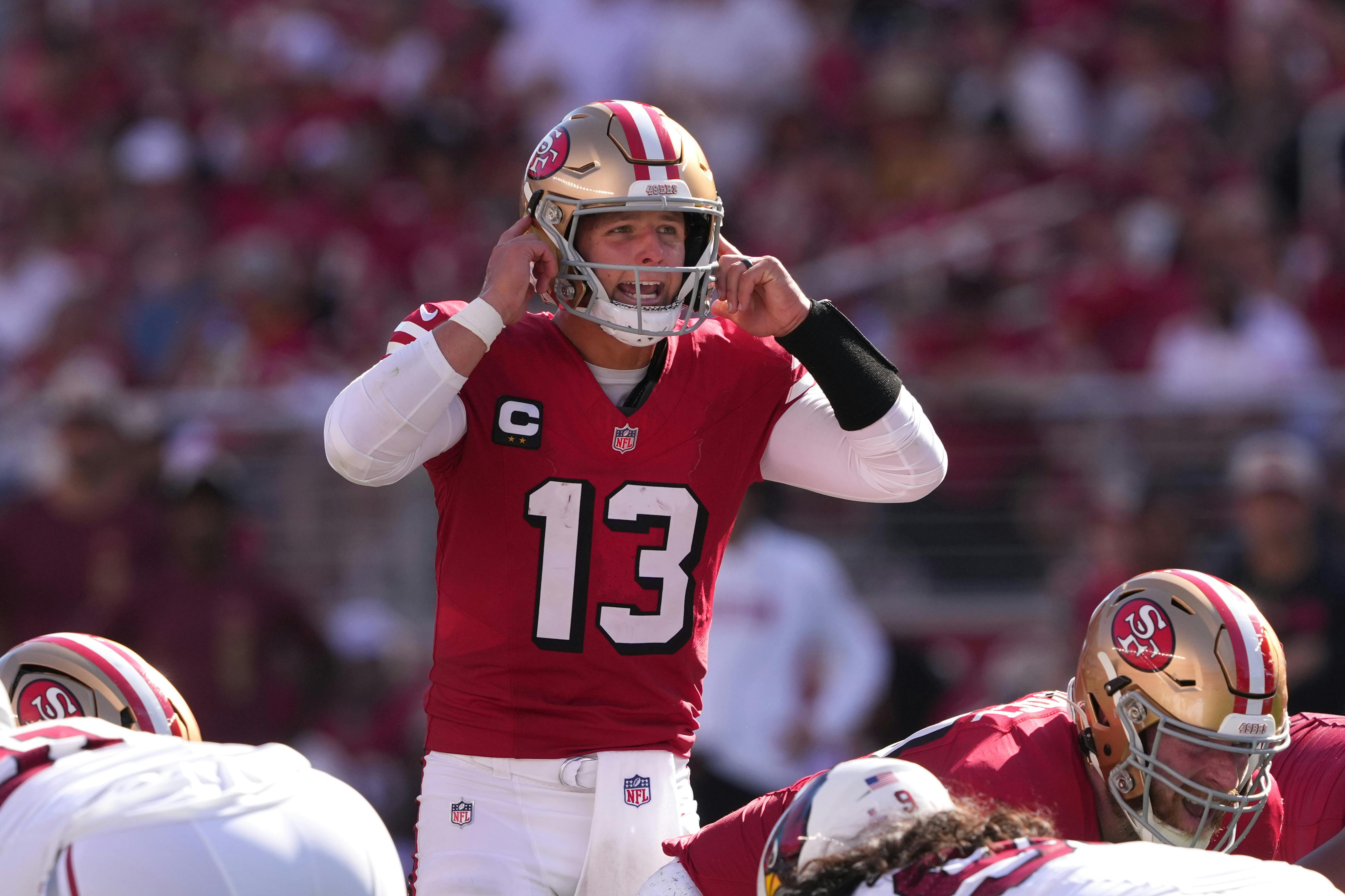 San Francisco 49ers quarterback Brock Purdy yells as we offer our NFL Week 8 odds and predictions.