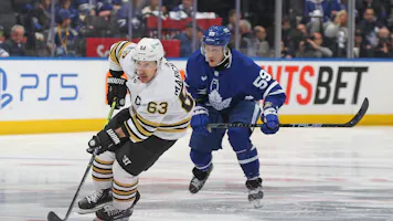 Brad Marchand of the Boston Bruins skates with the puck as we look at our favorite Maple Leafs vs. Bruins player props for Game 7